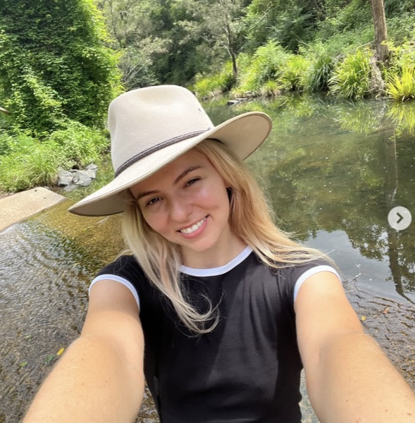 Amy Angus naturopath outdoors at creek in Brisbane